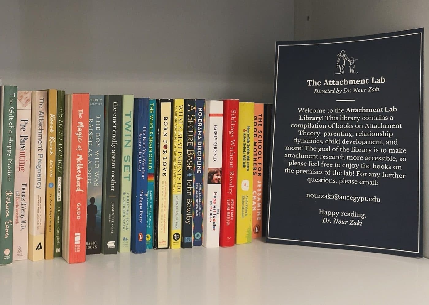 The Attachment Library shelves and welcome sign